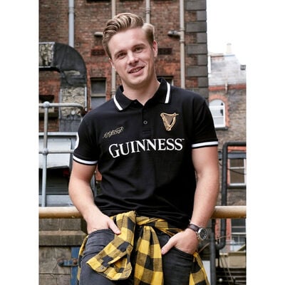 Black Guinness Polo Shirt With Harp Crest And Arthur Guinness Signature in Gold Text