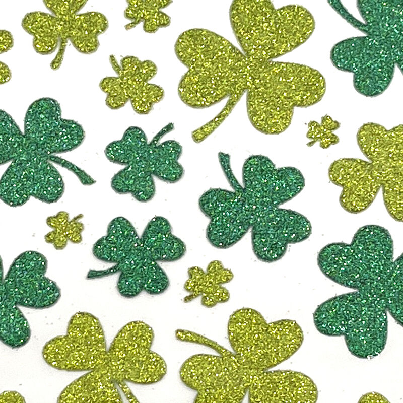 Pack Of Shamrock Stickers In Different Sizes With A Green Glitter Design