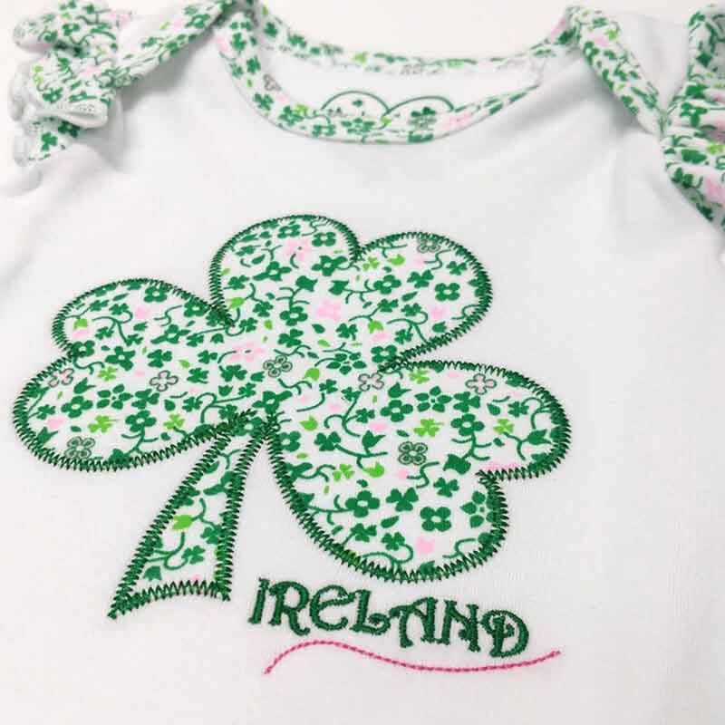 White Baby Vest With Shamrock And flowers Design